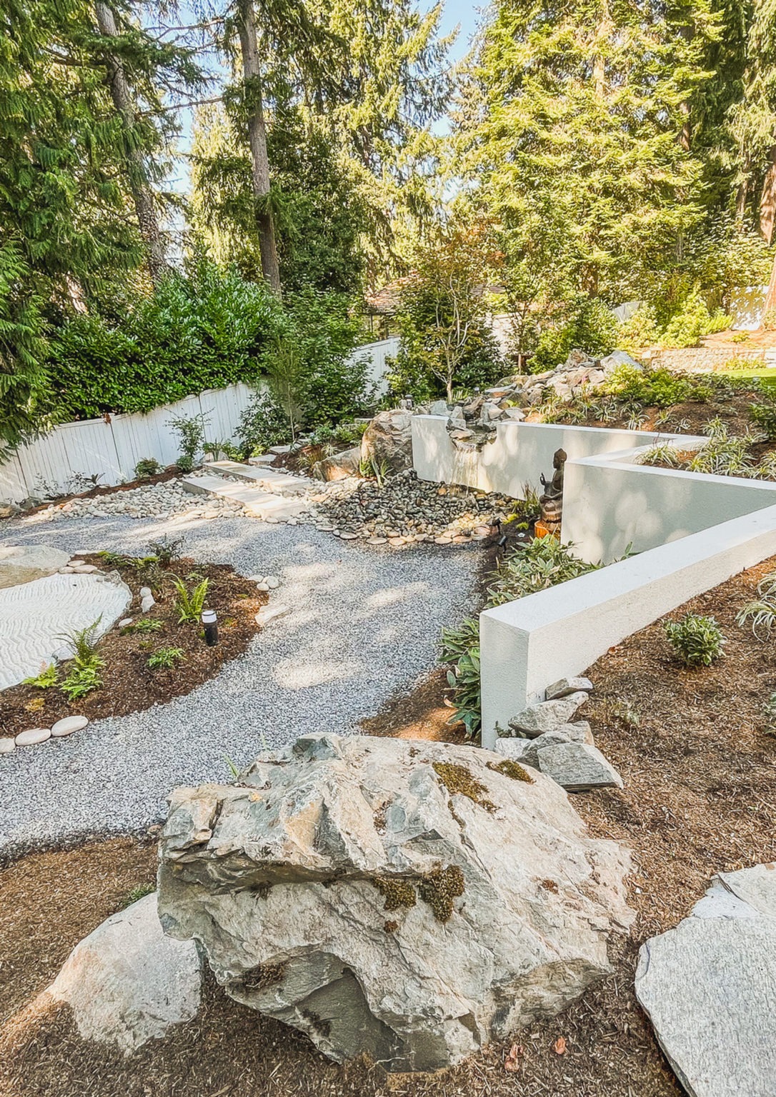 Smooth white stucco retaining wall in the Japanese Garden project