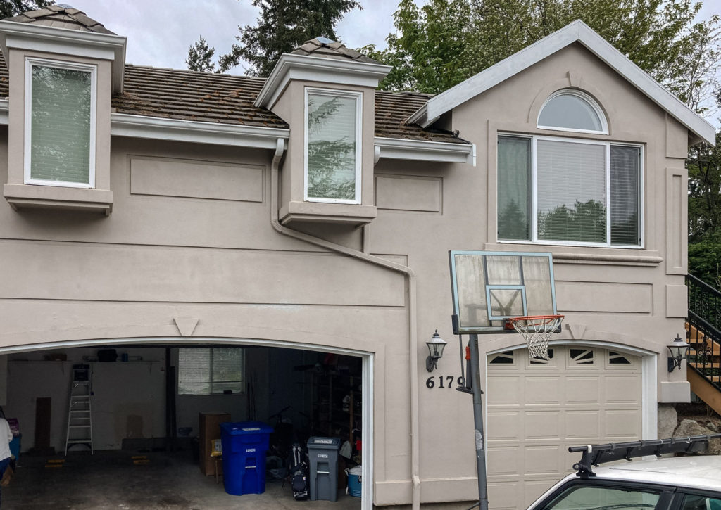 Fresh stucco repair on a residential facade in the Ginger Repair project