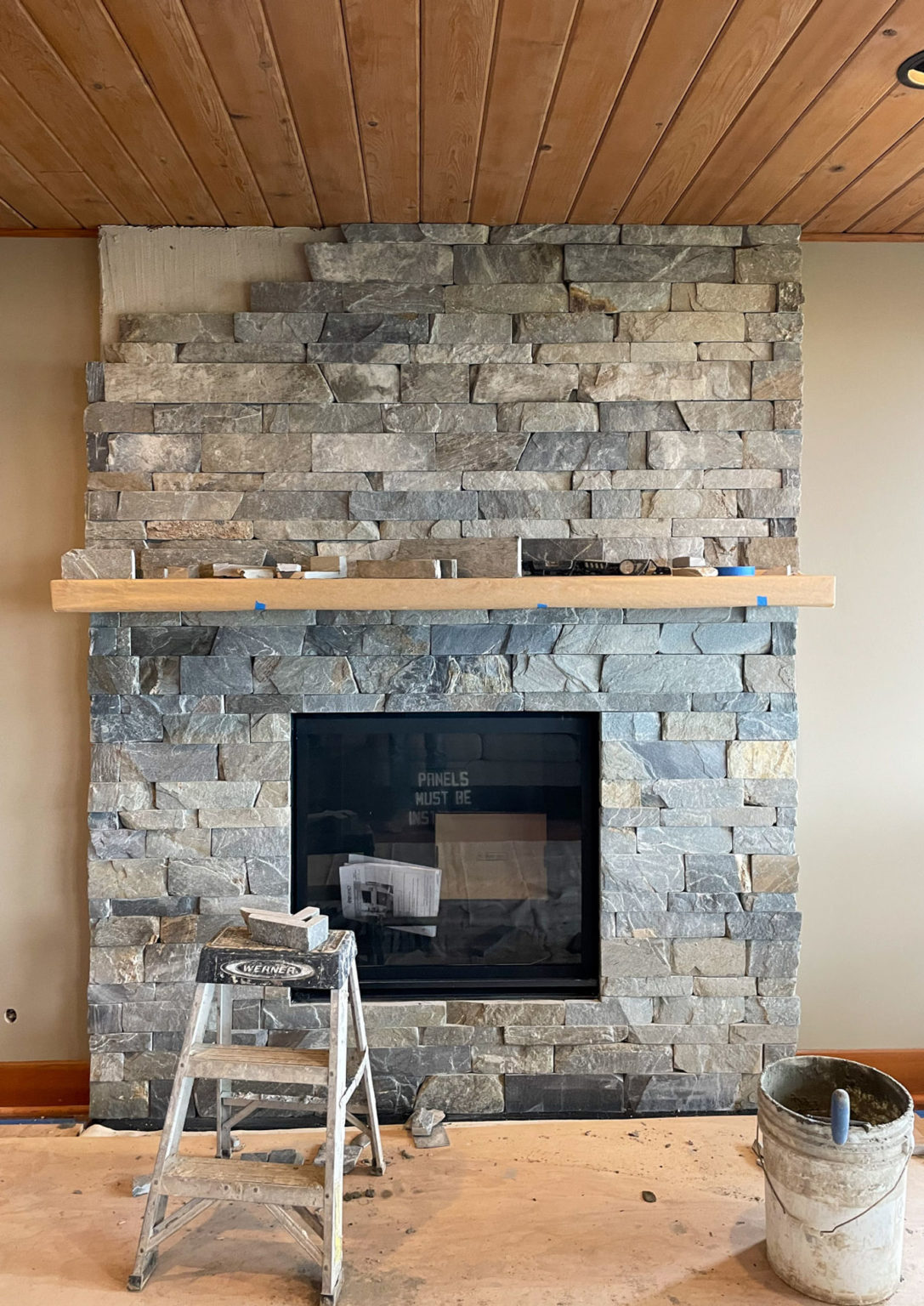 Stone veneer fireplace wall in the Simple K2 project