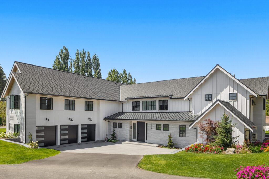 Light stone veneer and farmhouse-style exterior on the Bridle Trails project