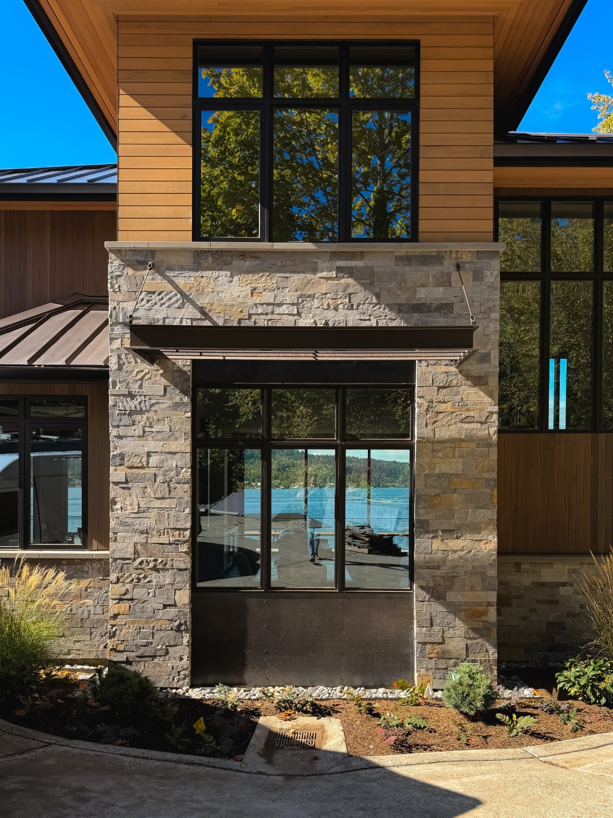 Tall fireplace stone masonry in the Sammamish Waterfront project